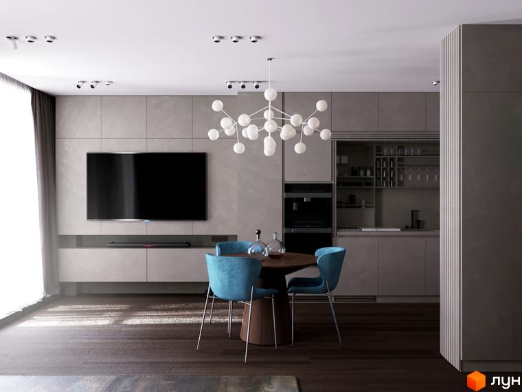Інтер'єр вітальні з обідньою зоною в житловому комплексі Fenix. Сірі стіни, великий телевізор, обідній стіл з синіми стільцями та сучасна люстра.