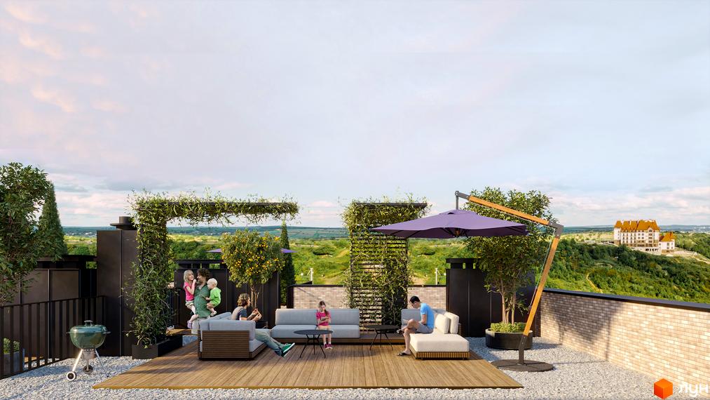 Тераса житлового комплексу WAWEL з дитячою зоною та зоною відпочинку. Відкривається вид на зелені пагорби та будівлю вдалині.