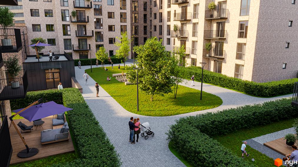 Житловий комплекс WAWEL з цегляним фасадом та просторим внутрішнім двором із зеленими зонами та місцями для відпочинку.