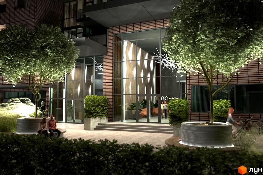 Житловий комплекс AUROOM AIR з підсвіченою вхідною групою та озелененою прибудинковою територією з деревами та кущами.