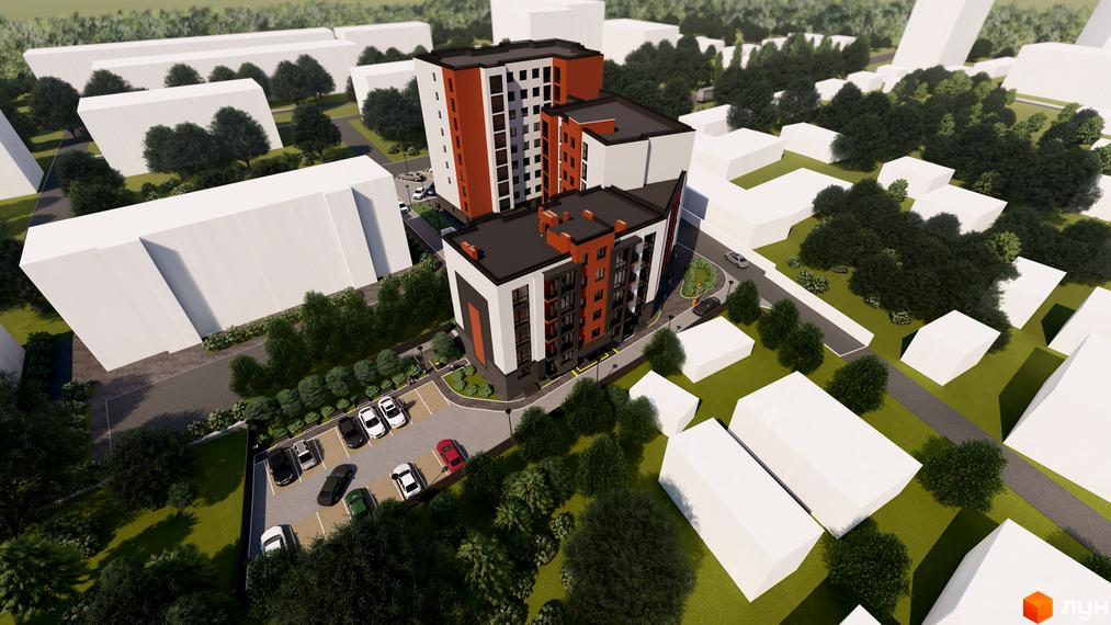 Зовнішній вигляд житлового комплексу Флагман з цегляними та білими фасадами та прибудинковою територією з парковкою та зеленими насадженнями.