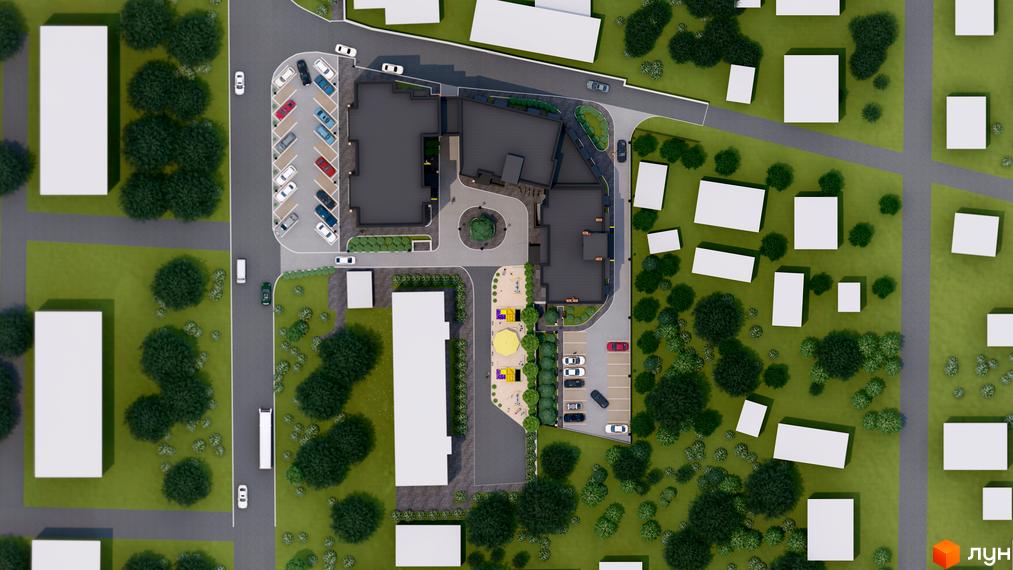 Вид зверху на житловий комплекс Флагман з парковкою та дитячим майданчиком. Навколо комплексу багато зелені та розташовані білі будівлі.