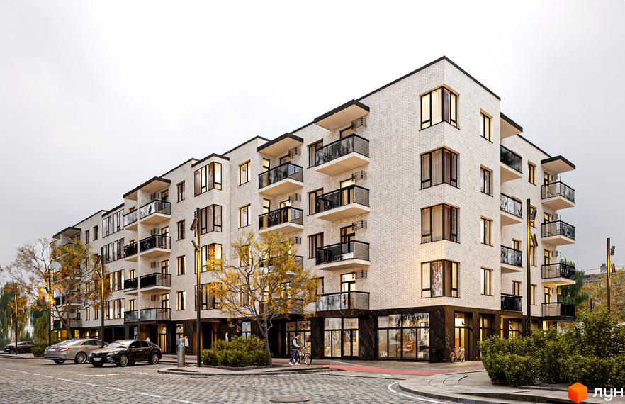 Житловий комплекс Сторожницький з білою цегляною кладкою, балконами та панорамними вікнами. На прибудинковій території розташовані дерева, тротуари та парковка.