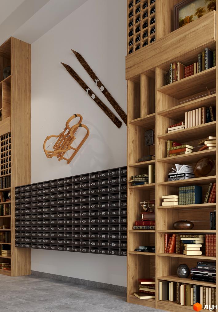 Інтер'єр житлового комплексу Chalet з дерев'яними елементами та книжковими полицями. Декоративні лижі та санки додають затишку простору.