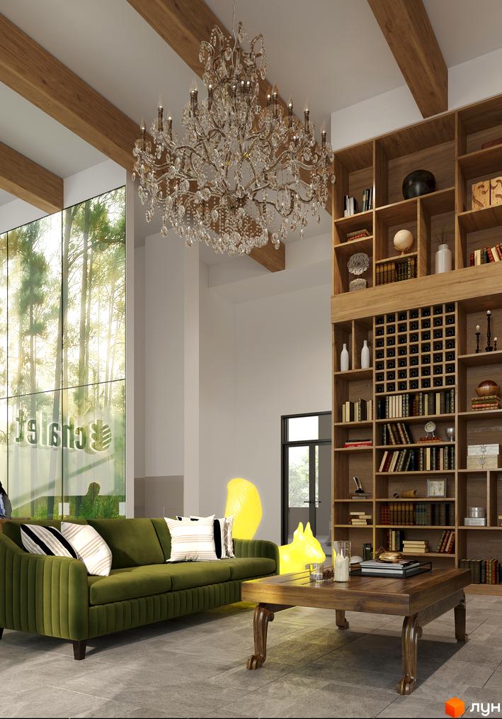 Дизайн інтер'єру житлового комплексу Chalet з зеленим диваном, кавовим столиком та великою книжковою шафою. Великі вікна з видом на ліс.