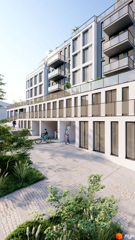 Новобудова ЖК Praud Premium з балконами та великими вікнами. Прибудинкова територія з бруківкою та зеленими насадженнями.