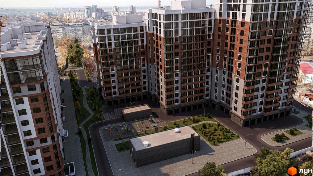 Житловий комплекс Золота Ера з фасадами з цегли та великими вікнами. На території комплексу є дитячий майданчик та зелені насадження.