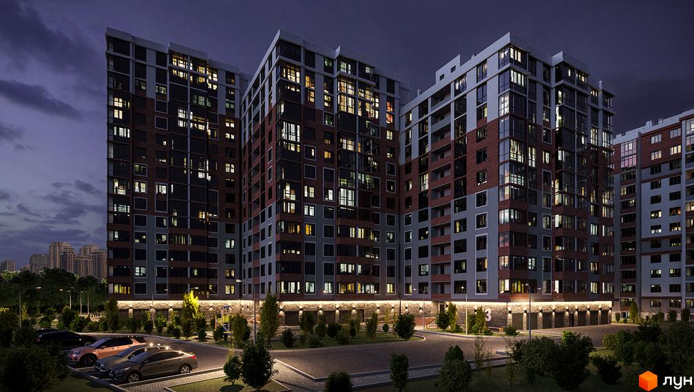 Високоповерховий житловий комплекс Золота Ера вночі. Фасад будинку з цегли та сірого кольору, освітлення на території. На передньому плані припарковані автомобілі.