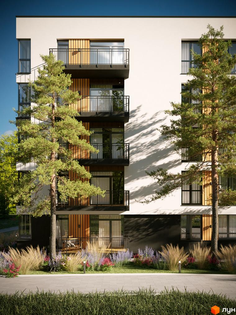 Фасад Житлового комплексу SVOЇ PARKHOUSE з білими стінами, темними балконами та дерев'яними елементами. Перед будинком зелені насадження та доріжка.