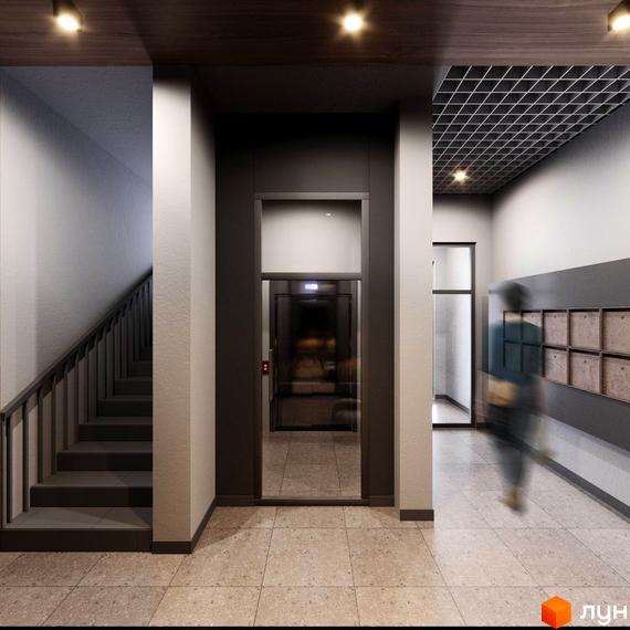 Сучасний вхід у житловий комплекс PRAUD select з ліфтом та сходовим маршем. Коридор з поштовими скриньками та освітленням.