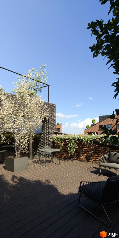 Тераса на даху з дерев'яною підлогою, столиком та кріслами. Цегляна стіна з рослинами та зеленню, що створює затишну атмосферу в ЖК MAVERICK.