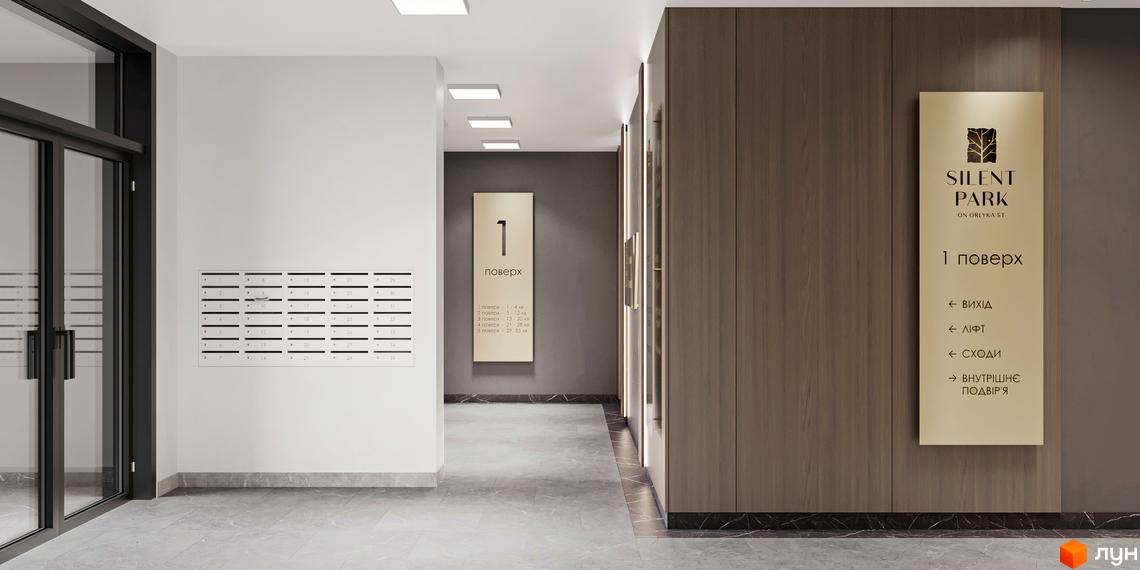 Інтер'єр першого поверху житлового комплексу SILENT PARK з поштовими скриньками та навігацією до ліфта та виходу.
