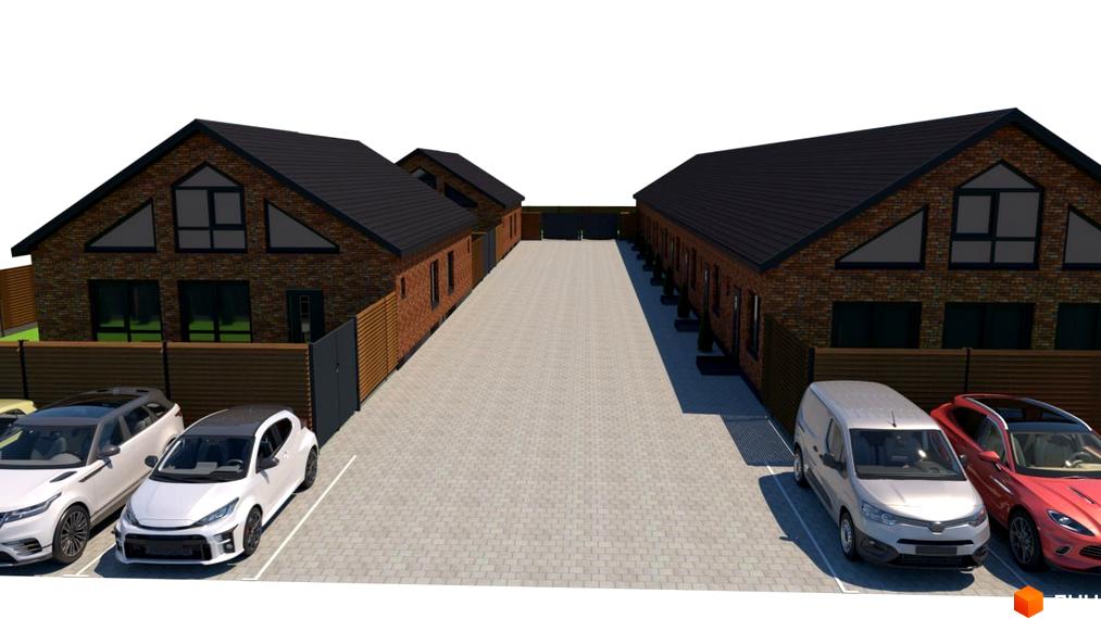 Котеджне містечко Західна Баварія: цегляні будинки з темними дахами та великими вікнами. Перед будинками вимощена дорога та парковка з автомобілями.