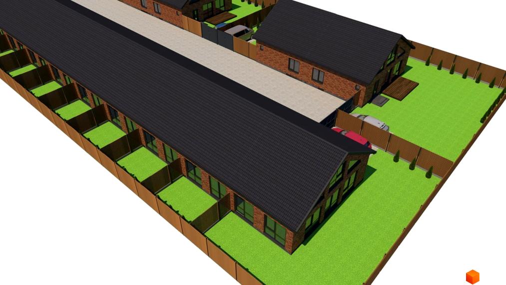 Вигляд на Котеджне містечко Західна Баварія з будинками з червоної цегли та зеленими газонами. На території припарковані автомобілі.