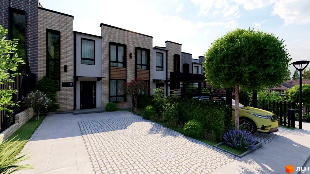 Зображення фасаду та прибудинкової території Котеджного містечка Симфонія. Перед будинком акуратний газон та доріжка з бруківки.