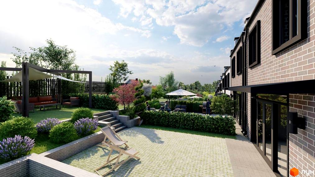 Котеджне містечко Симфонія: будинки з цегляними фасадами та доглянута прибудинкова територія з мощенням і зеленими зонами.