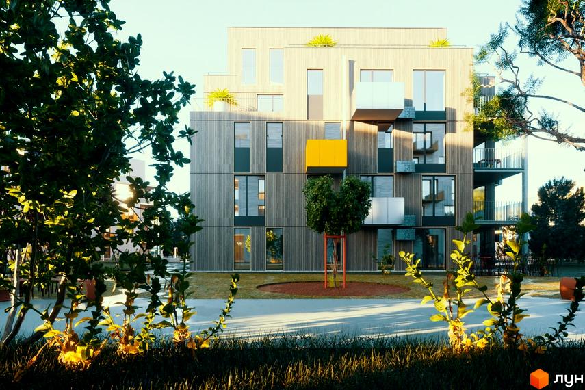 Зображення фасаду будинку Житлового комплексу Swedish Quarter. Навколо будинку зелена прибудинкова територія з деревами та газонами.