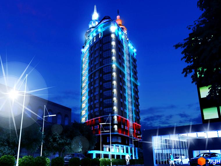 Житловий комплекс Зарічний вночі, яскраво освітлений, з прибудинковою територією та автомобілями на парковці.