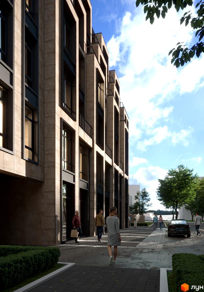 Зовнішній вигляд житлового комплексу Family Space з фасадом з натурального каменю та великими вікнами. Прибудинкова територія з пішохідними доріжками та зеленими насадженнями.