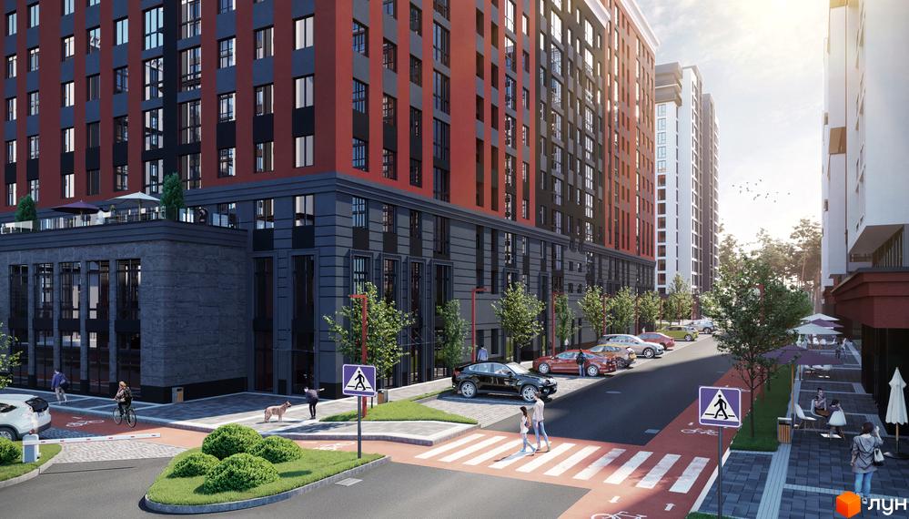 Зовнішній вигляд житлового комплексу Irpin City з червоно-сірими фасадами та прибудинковою територією з пішохідними переходами та зонами відпочинку.