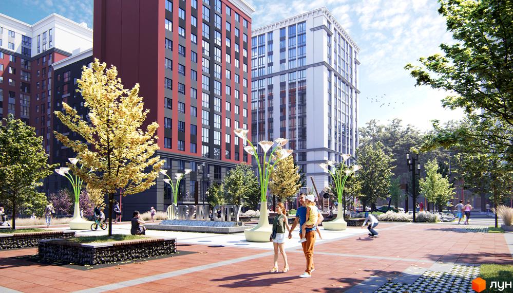 Житловий комплекс Irpin City: сучасні багатоповерхові будинки з червоною та білою фасадною обробкою. Прибудинкова територія з деревами, лавками та дитячим майданчиком.