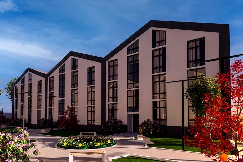 Фасад новобудови на вул. Тарасівська, 1, з великими вікнами та похилим дахом. Прибудинкова територія з квітами, деревами та лавками.