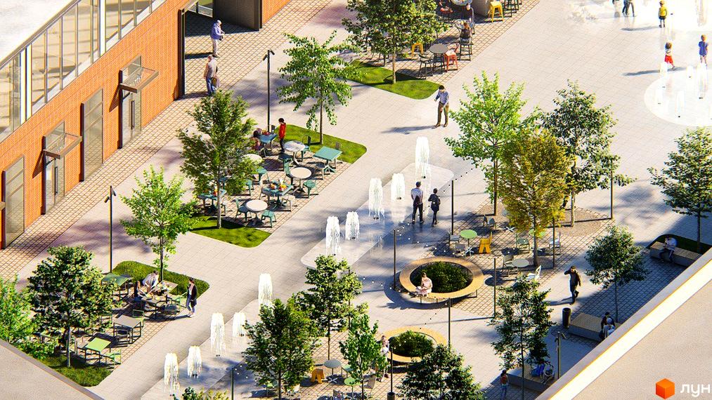 Зовнішній вигляд житлового комплексу ЖК РЕМ з цегляним фасадом та великими вікнами, що виходить на облаштовану прибудинкову територію з фонтанами та зонами відпочинку.