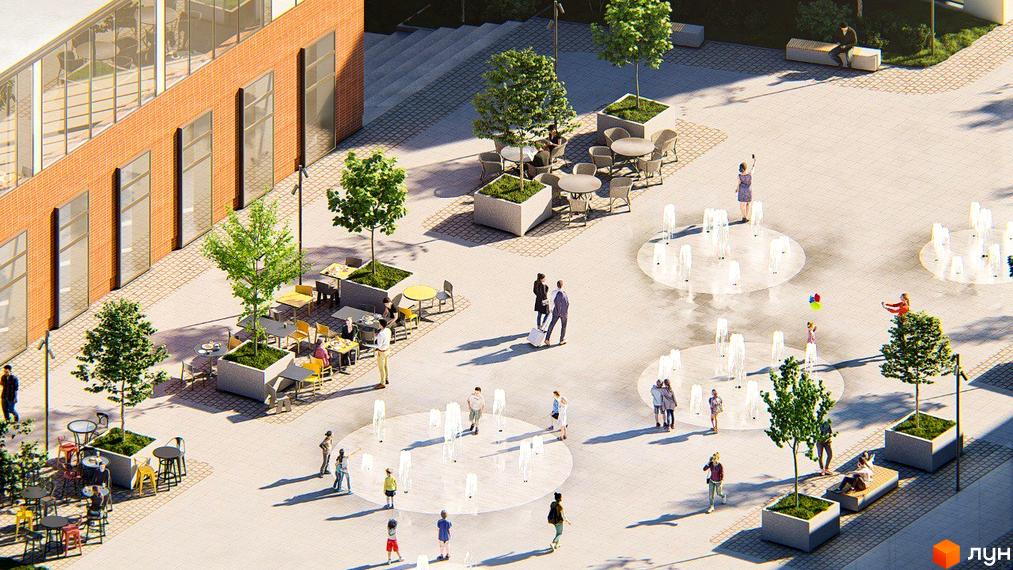 Житловий комплекс РЕМ з цегляним фасадом та просторою прибудинковою територією з фонтанами та зонами відпочинку.