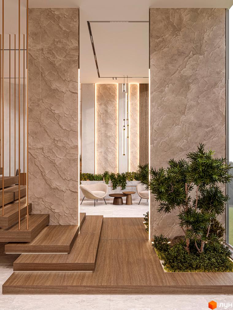 Інтер'єр житлового комплексу Olegiv Boutique Residence: дерев'яні сходи, оздоблення стін під камінь, зелені насадження, зона відпочинку з кріслами.