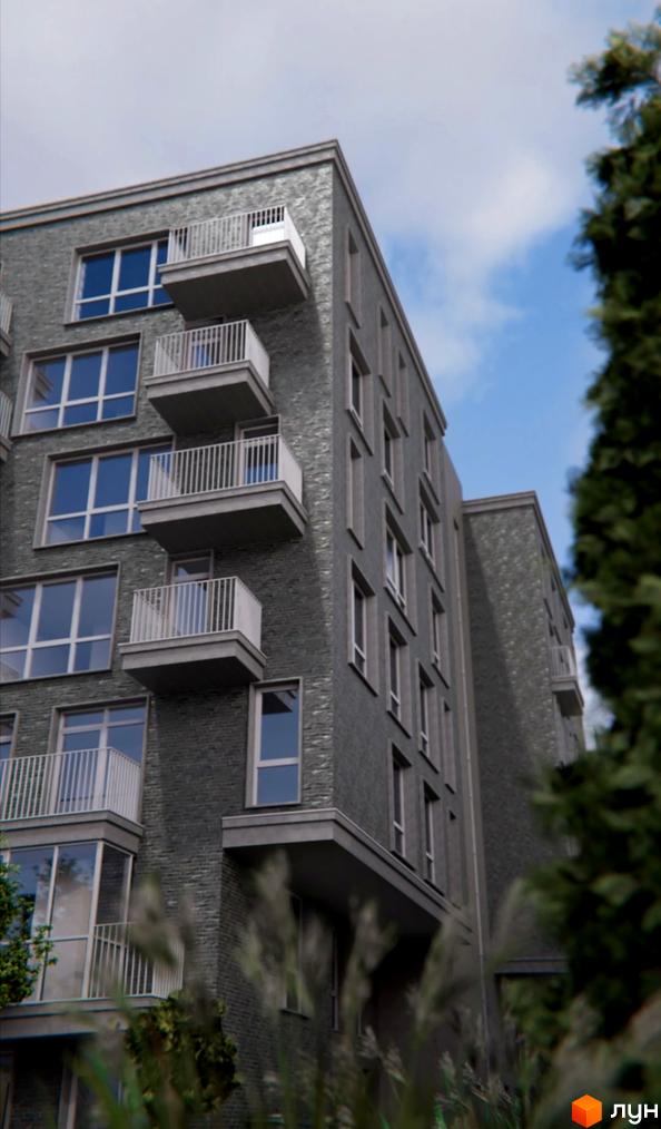 Зовнішній вигляд новобудови ЖК AcademHoff з балконами та великими вікнами. Навколо будинку зелені насадження та трава.