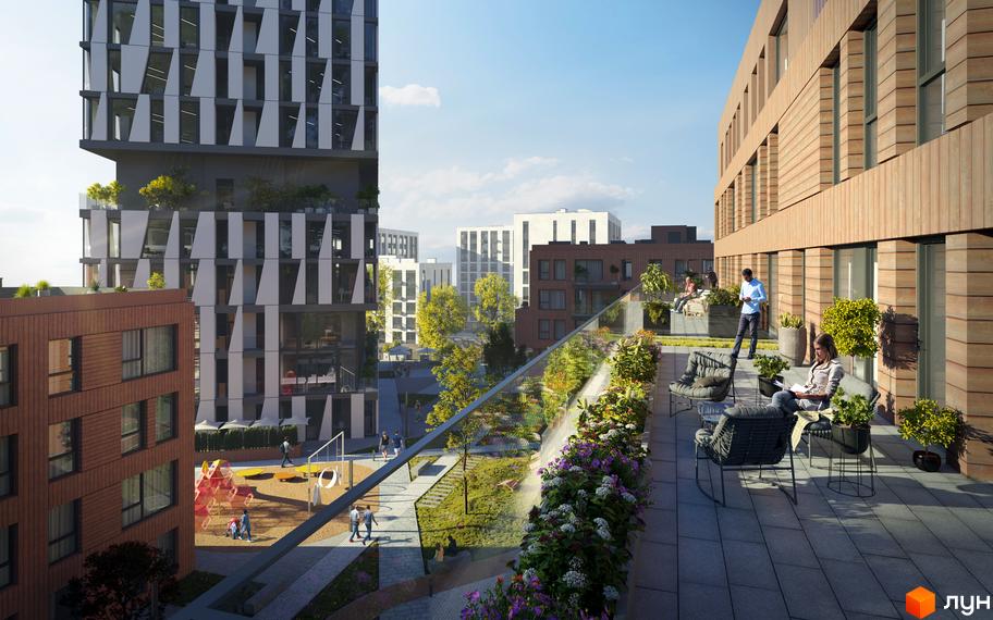 Комплекс N69 Residents з цегляним фасадом та терасами, що виходять на зелений двір з дитячим майданчиком.