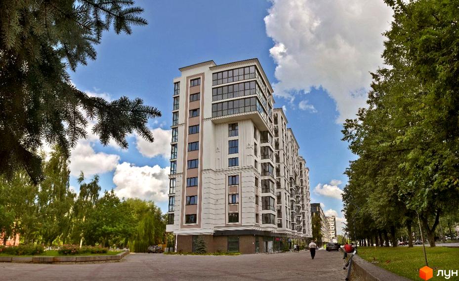 Житловий комплекс GREAT HOUSE з біло-бежевим фасадом та панорамними вікнами, оточений зеленню та деревами.