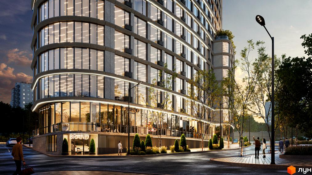 Новобудова ЖК Delrey з панорамними вікнами та підсвіткою фасаду, оточена зеленими насадженнями та міською інфраструктурою.