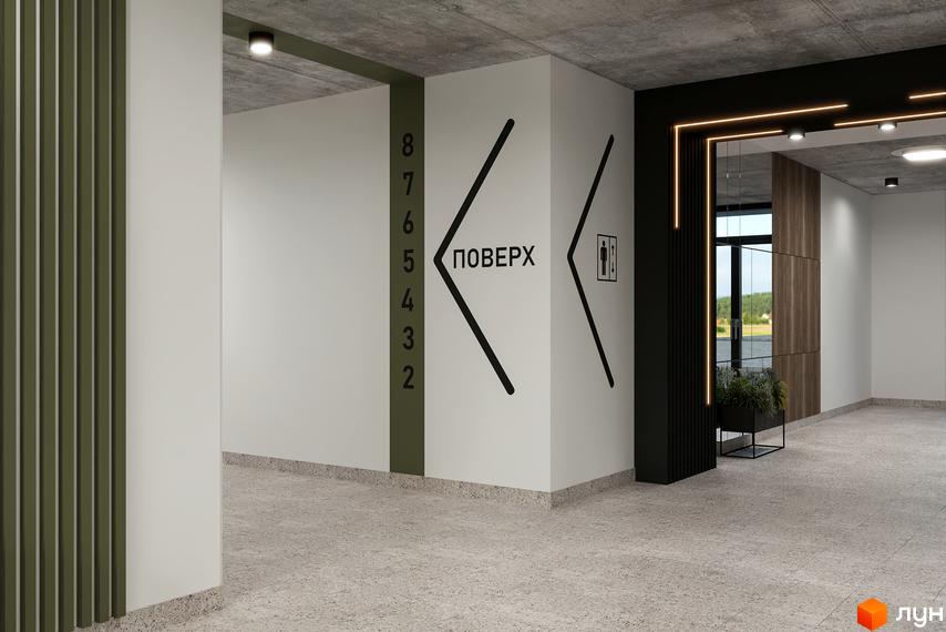 Інтер'єр новобудови ЖК HYGGE LUX з навігацією по поверхах та вказівниками до туалету. Сучасний дизайн холу з оздобленням стін та підлоги.