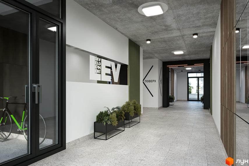 Сучасний дизайн вхідної групи житлового комплексу HYGGE LUX з елементами декору та озелененням. Огляд коридору з виходом назовні.