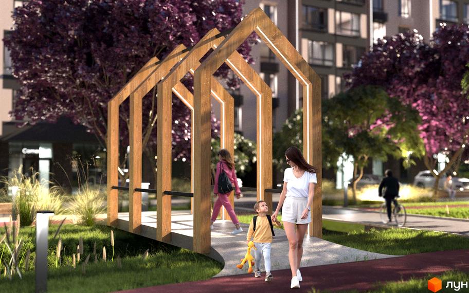 Житловий комплекс Edem Перлина Проскурова-4. Сім'я гуляє біля дерев'яної арки з підсвіткою на фоні багатоповерхових будинків.