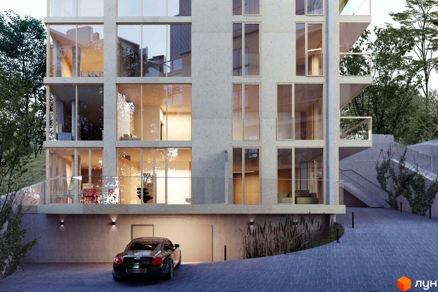 Фасад новобудови на вул. Ярославенка, 23а з великими вікнами та балконами, прибудинкова територія з дорогою та автомобілем.