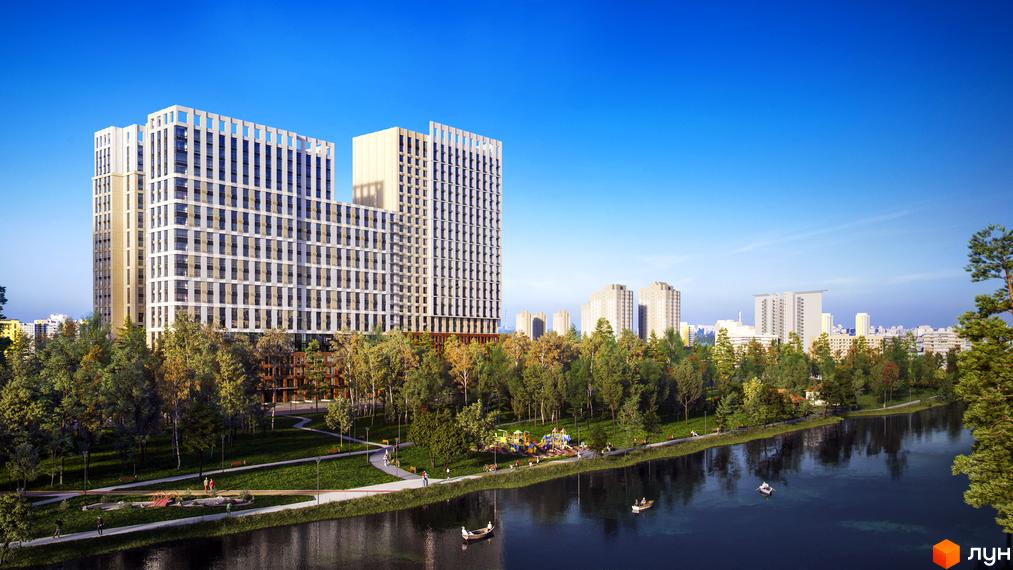 Житловий комплекс Новий Автограф з високими будівлями та парковою зоною біля річки. На території комплексу розташований дитячий майданчик та місця для відпочинку.