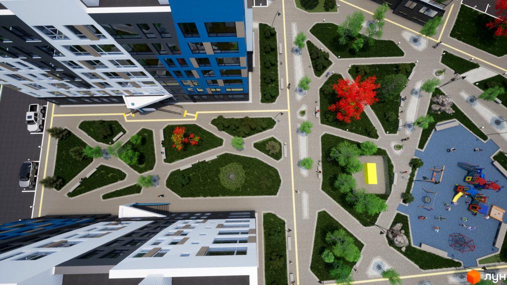 Вигляд зверху на Житловий район One Family: багатоповерховий будинок з дитячим майданчиком та озелененою територією.