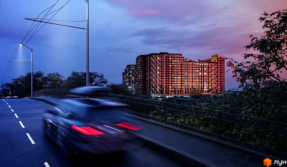 Житловий комплекс SKYGARDEN з багатоповерховими будинками та освітленими фасадами, розташований біля дороги з рухомим автомобілем.