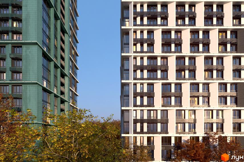 Фасад житлового комплексу Central Hills з зеленою та світлою оздобленням. Поруч видно дерева з осіннім листям.