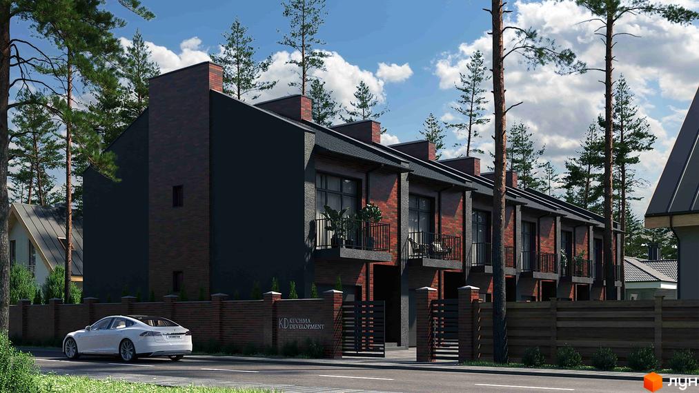 Таунхауси Позітано Центр з цегляним фасадом та балконами, оточені деревами та огороджені парканом. Поруч дорога з білим автомобілем.