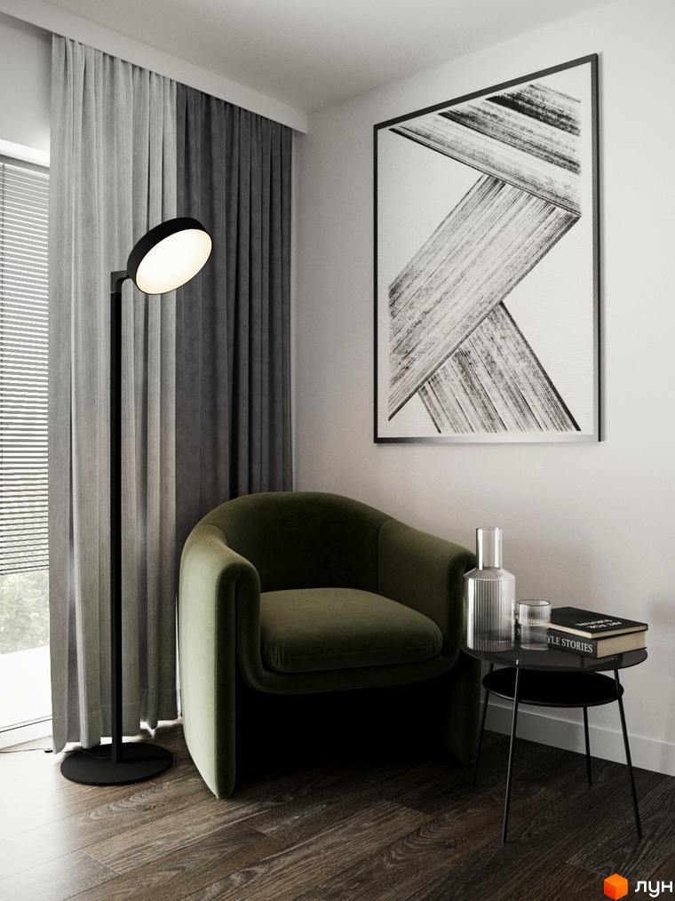 Інтер'єр вітальні в КМ Перлина Процева з кріслом, торшером та картиною. Затишна атмосфера для відпочинку та читання.