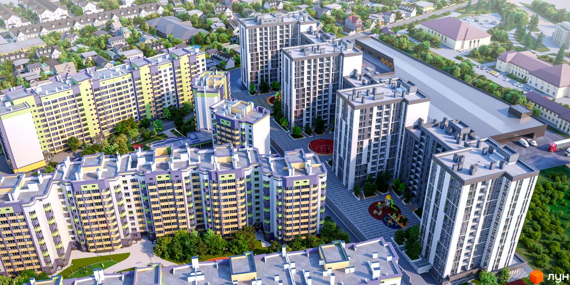 Житловий комплекс Щасливий Grand. Зовнішній вигляд багатоповерхових будинків з різнокольоровими фасадами та прибудинкова територія з дитячими майданчиками.