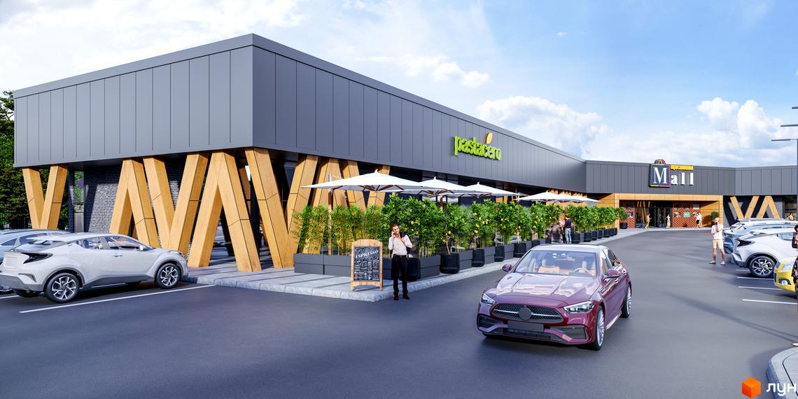 Житловий комплекс Щасливий Grand з фасадом з сірих панелей та дерев'яними опорами, перед ним парковка та зелена зона з парасольками.