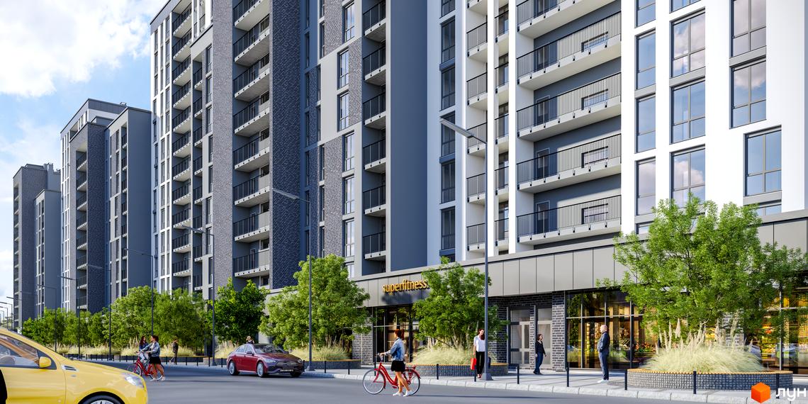 Зовнішній вигляд новобудови ЖК Щасливий Grand з фасадами з сірої цегли та великими вікнами. Прибудинкова територія з деревами та місцями для відпочинку.