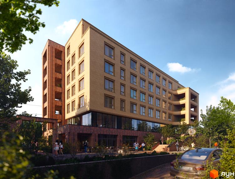 Зовнішній вигляд житлового комплексу AUROOM LIVING з цегляним фасадом та балконами. На прибудинковій території видно зелені насадження та зону відпочинку.