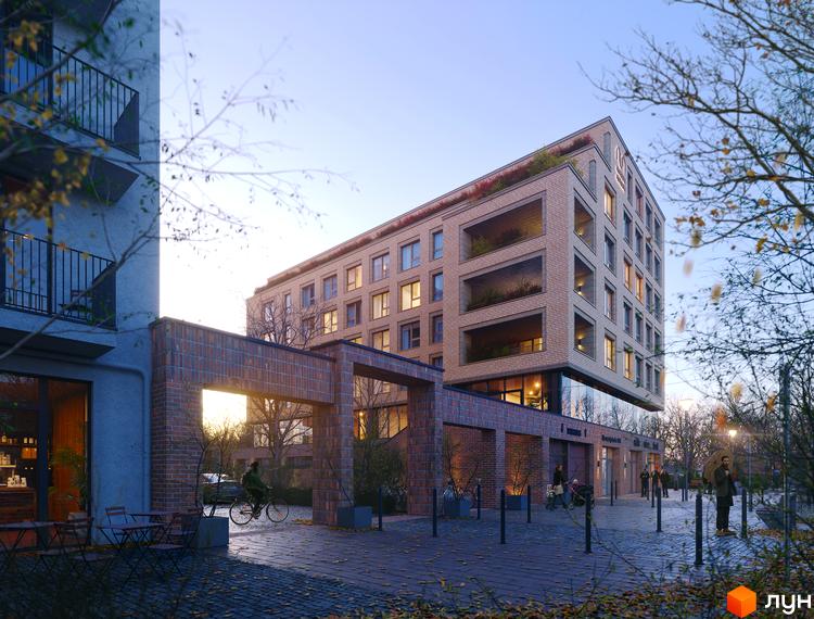 Новобудова AUROOM LVIVING з цегляним фасадом та балконами, що виступають, оточена вимощеною територією з деревами та вуличними ліхтарями.