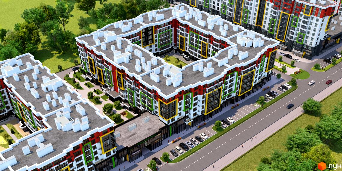 Житловий комплекс Добре Місто 2 з яскравими фасадами та великою прибудинковою територією з парковкою та зеленими насадженнями.