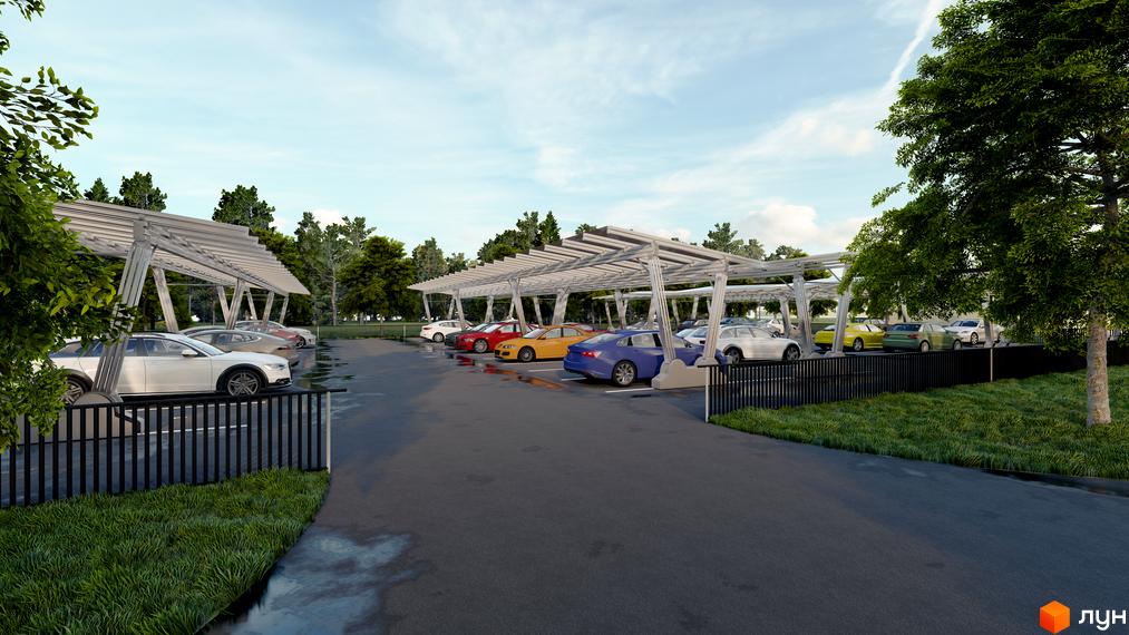 Паркінг житлового комплексу Південний DELUXE з навісами для автомобілів. На території комплексу є зелені насадження та асфальтовані доріжки.
